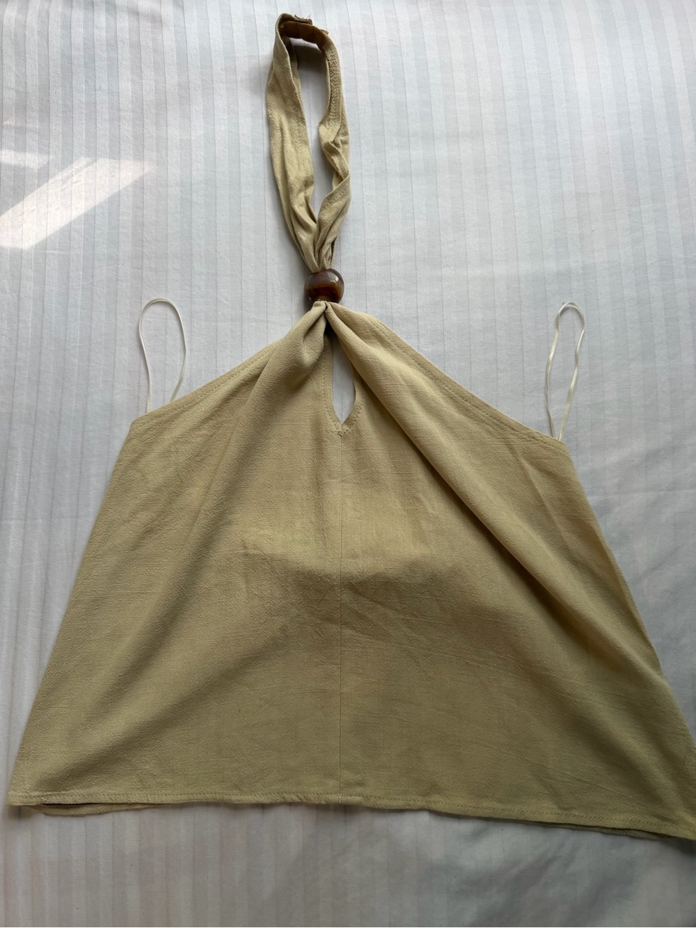 Edikted tan halter top with brown tortoise bead accent and front keyhole cutout